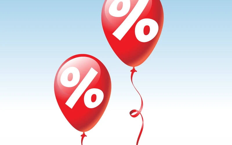 Grafik: zwei rote Luftballons mit wei&szlig;en Prozentzeichen vor hellblauem Hintergrund.